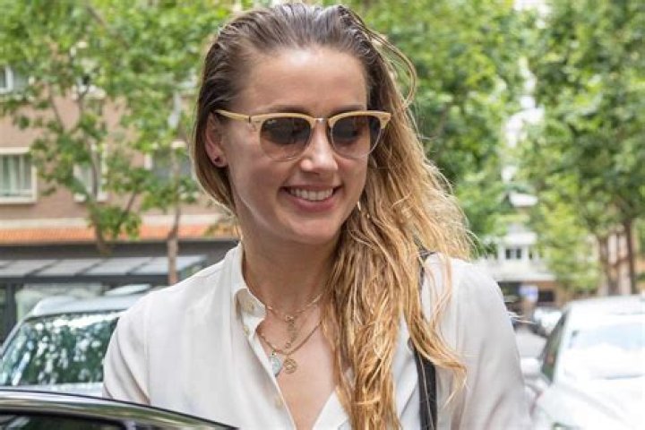 Amber Heard 'seemed to f**k with Depp's head' when his mother died according to friend