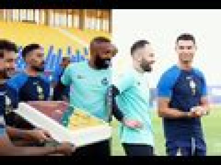 Cristiano Ronaldo reacts to a big cake from teammates as he celebrates a stellar season with Al Nassr