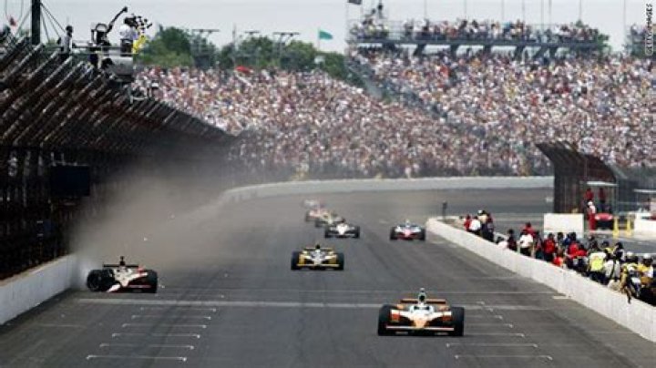 Dan Wheldon wins Indy 500 in spectacular finish
