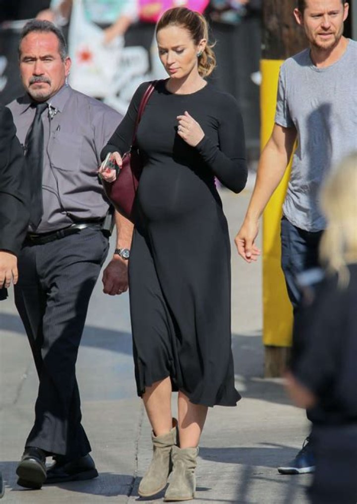 Emily Blunt Shows Off Baby Bump in Black Dress
